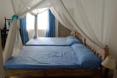Voodi või voodid majutusasutuse Blue Marlin Sporting Resort toas