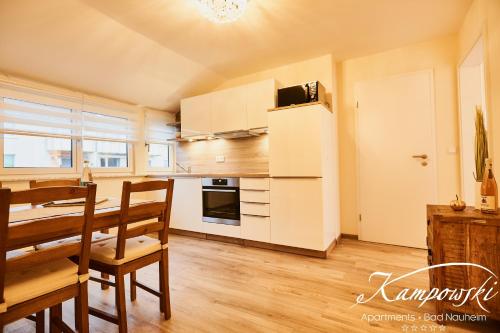 Кухня или мини-кухня в Kampowski Apartments Deluxe
