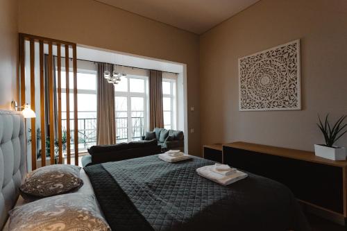 Een bed of bedden in een kamer bij Tamula Sunset Apartment