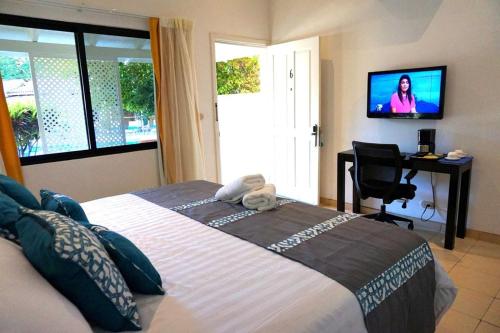En eller flere senge i et værelse på Seis Playas Hotel
