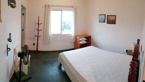 Un pat sau paturi într-o cameră la RIVIERA DE SÃO LOURENÇO
