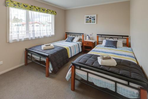 Postel nebo postele na pokoji v ubytování Leigh Cottage Manapouri