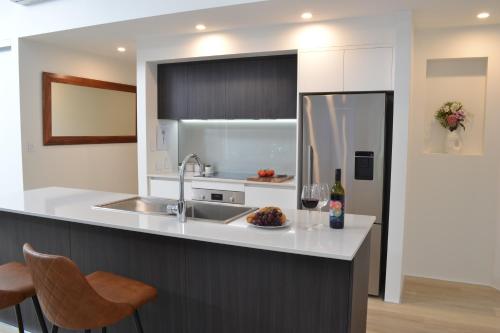 a kitchen with a sink and a counter at The Tipsy Grape Downtown, Margaret River in Margaret River Town