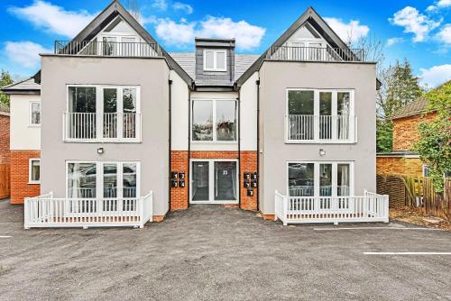 an image of a house with a driveway at Braywick Serviced Apartments by Ferndale in Maidenhead