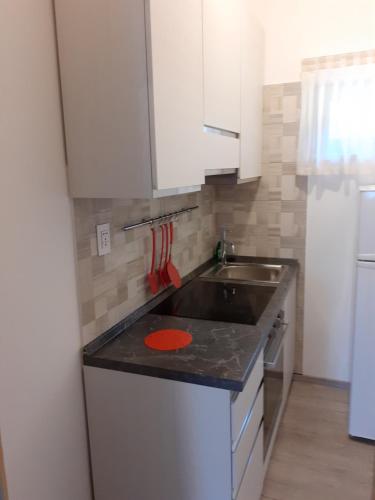 Η κουζίνα ή μικρή κουζίνα στο Residence Le Palme appartamenti