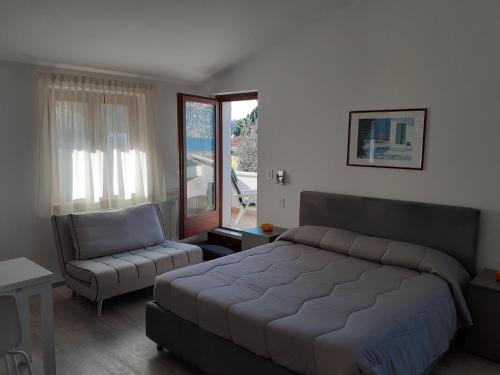 Ένα ή περισσότερα κρεβάτια σε δωμάτιο στο Residence Le Palme appartamenti