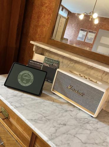 a laptop sitting on top of a marble counter at DU GLACIER Boutique & Traditions Hotel in Fiesch
