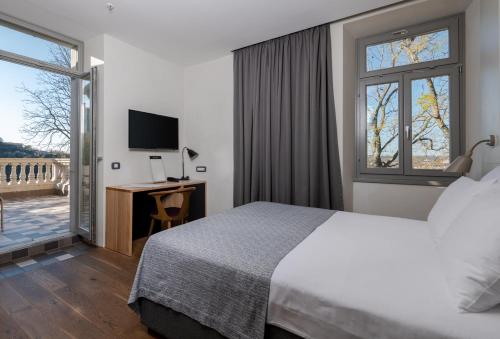 Postel nebo postele na pokoji v ubytování Hotel Peteani