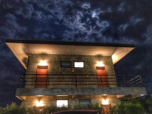 a building with lights on top of it at night at Amante Baristro Hotel & Cafe' @Pua in Nan