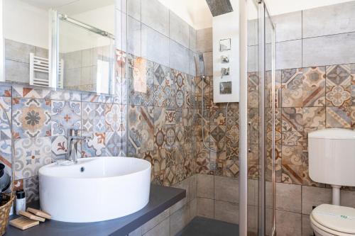 a bathroom with a sink and a shower at Gold Oasi - Business Solution in Ferrara