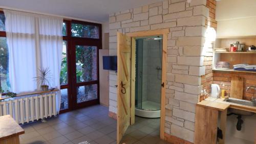 a bathroom with a sink and a toilet in a room at Pokoje do wynajęcia in Nowogrodziec