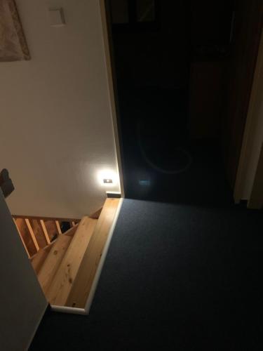 an empty room with a door and a wooden floor at Čistá v Krkonoších - Chata Belmonda in Cerny Dul
