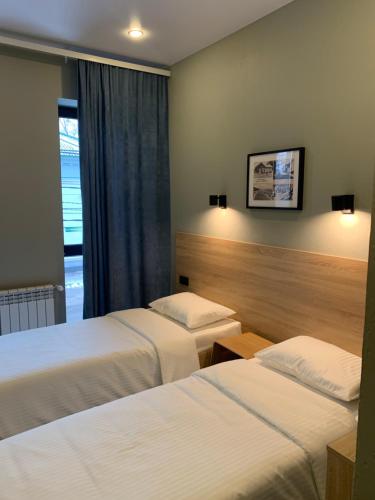 Ένα ή περισσότερα κρεβάτια σε δωμάτιο στο Мини отель Muritz
