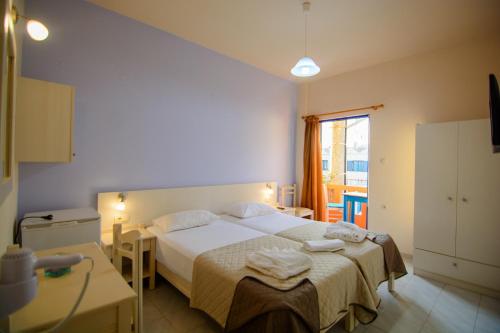 Postel nebo postele na pokoji v ubytování Scorpios Family Rooms