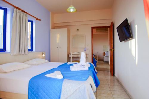 Postel nebo postele na pokoji v ubytování Scorpios Family Rooms