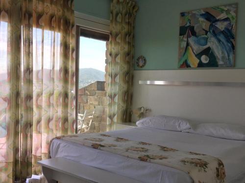 מיטה או מיטות בחדר ב-Panoramic Apartment Poggettone Air conditioned