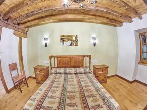 Ένα ή περισσότερα κρεβάτια σε δωμάτιο στο Casa Rural Lenco