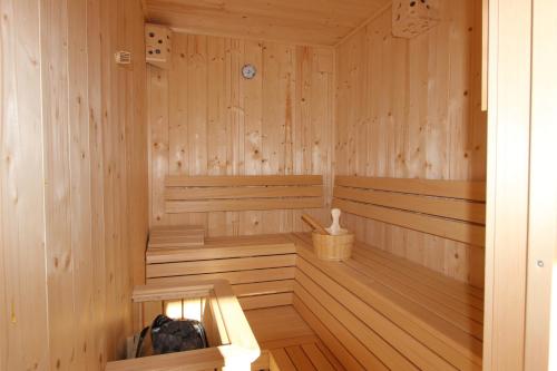 a wooden sauna with wooden floors and wooden walls at Chalet Maria in Ochsengarten