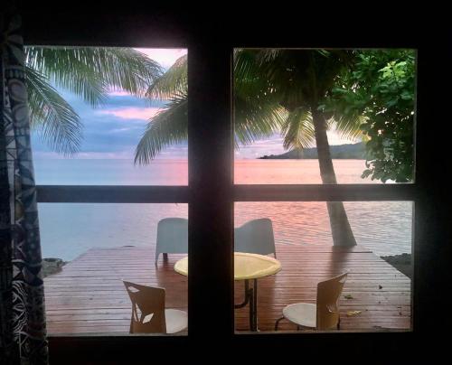 a view of a table and chairs from a window at Fare Vahine Oviri - 1048DTO-MT in Uturoa
