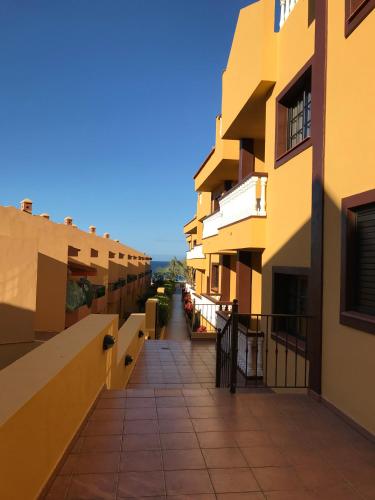 a view of a walkway between two buildings at Holiday in Playa Calera - Swimming pool in Valle Gran Rey