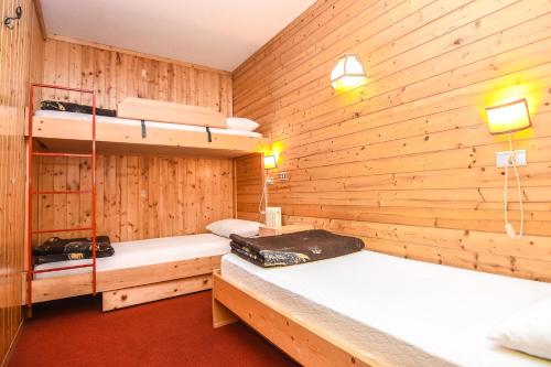 Posteľ alebo postele v izbe v ubytovaní Appartamenti Dolomiti con piscina e sauna