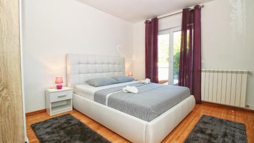 Postel nebo postele na pokoji v ubytování Guesthouse Esma