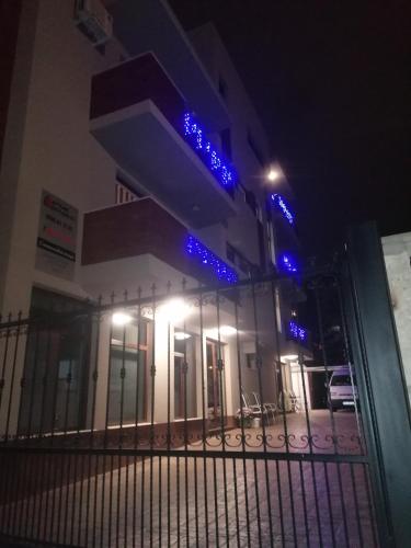 a building with blue lights on it at night at Дунав билдингс in Pleven