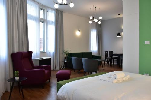 Postel nebo postele na pokoji v ubytování Osten Art Hotel