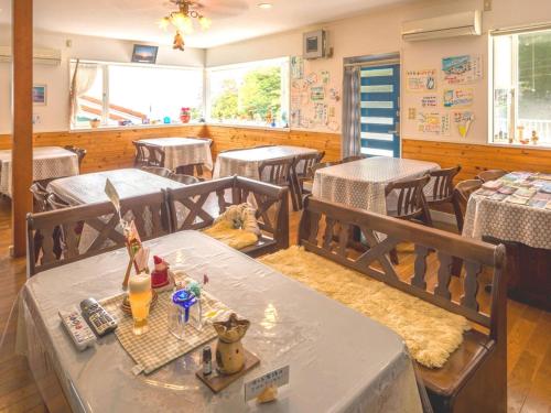 a dining room with tables and chairs in a restaurant at Kamo-gun - Hotel / Vacation STAY 41224 in Okawa