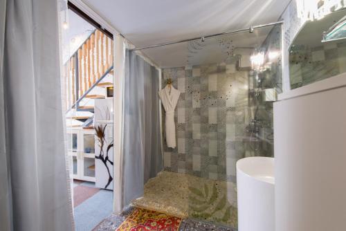 a bathroom with a shower and a sink at Inn OZZ in Karagandy