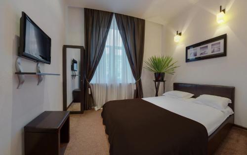 Postel nebo postele na pokoji v ubytování Reno Hotel