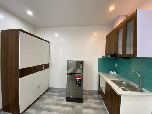 Kuchyň nebo kuchyňský kout v ubytování Trường Sinh Hotel