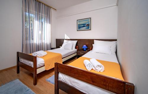 מיטה או מיטות בחדר ב-Apartments Lazarić