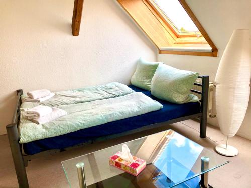 Un ou plusieurs lits dans un hébergement de l'établissement #WORLD Ferienwohnung Schkeuditz
