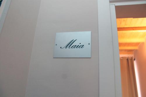 a sign on a wall with the word maxima on it at HOTEL VILLA ISA in Pescara