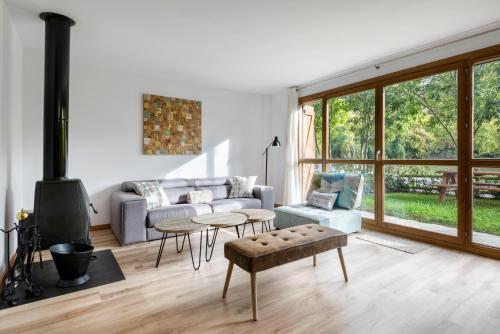 a living room with a couch and a fireplace at Chalet Casa La Cumbrecita en Panticosa in Panticosa