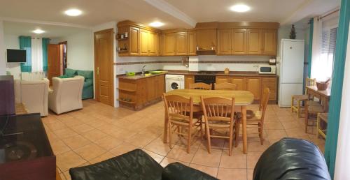 a kitchen with a table and chairs in a room at la casita de Daniel in Santa Cruz de Moya