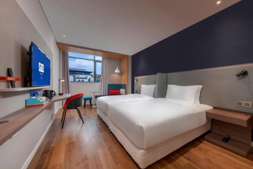 Ένα ή περισσότερα κρεβάτια σε δωμάτιο στο Holiday Inn Express Pinghu by IHG