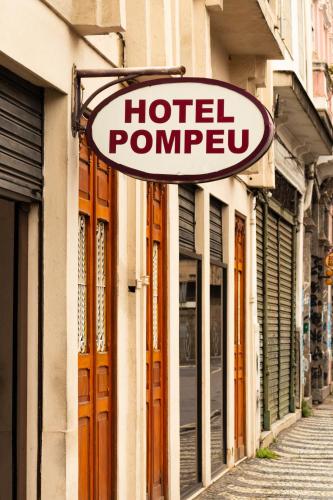 a hotel pump sign on the side of a building at Pompeu Rio Hotel in Rio de Janeiro