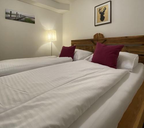 A bed or beds in a room at Ferienwohnung Bernadette
