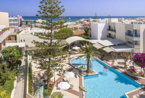 an aerial view of a resort with a swimming pool at Ibiscos Garden Hotel in Rethymno