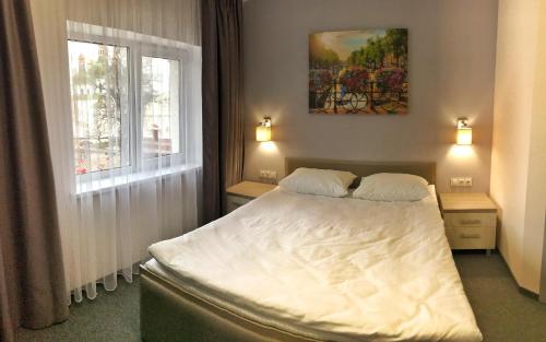 Ένα ή περισσότερα κρεβάτια σε δωμάτιο στο Park Hotel