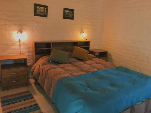 Ένα ή περισσότερα κρεβάτια σε δωμάτιο στο Los Coirones