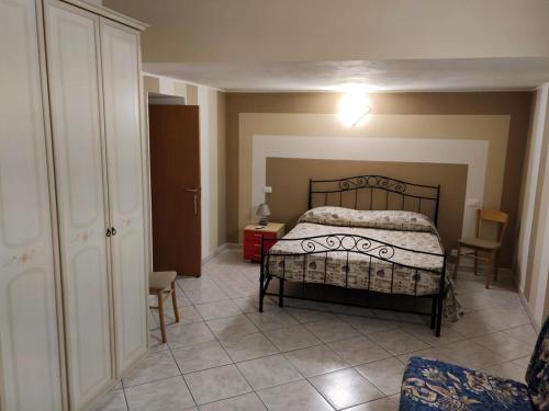 a bedroom with a bed and a table and chairs at Borgo Antico in Portocannone