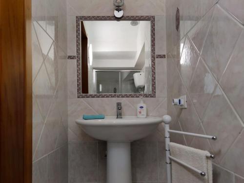 a bathroom with a sink and a mirror at Borgo Antico in Portocannone