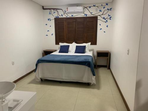 Giường trong phòng chung tại Pousada Brisas do Vale