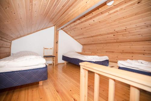 Ένα ή περισσότερα κρεβάτια σε δωμάτιο στο Kissankello Cottage