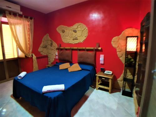 a bedroom with a bed with a bear mural on the wall at Hotel Ginevra in Naples