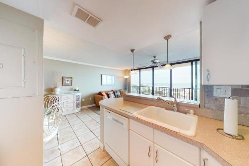 a kitchen with a sink and a living room at Sea Colony - 502 Annapolis House in Bethany Beach