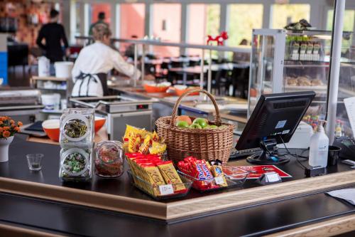a counter in a kitchen with food on it at Karlskoga Folkhögskola Vandrarhem Udden in Karlskoga
